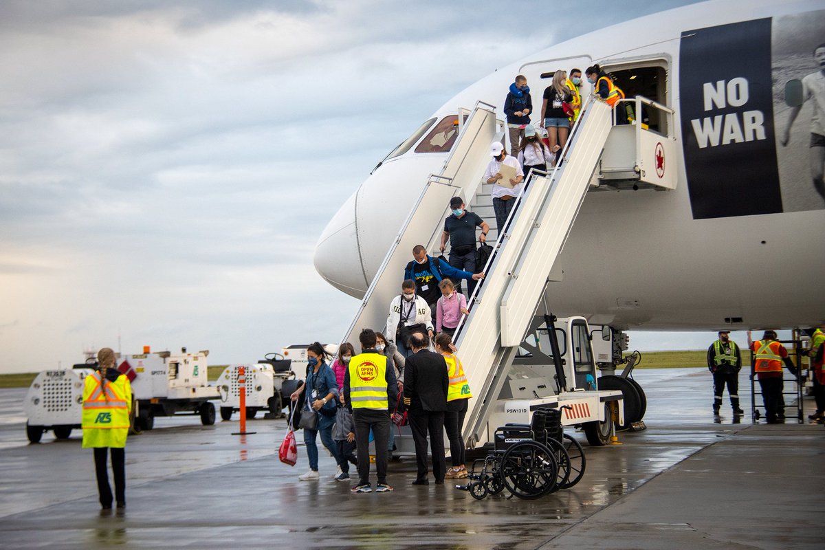 SKGov's tweet photo. Last night, 230 Ukrainian citizens arrived on a flight from Warsaw, Poland to Regina, Saskatchewan. Whether you came on last night’s flight or prior, Saskatchewan welcomes you. 
Contact us for information or help accessing supports at 1-833-613-0485 or ukrainesupport@gov.sk.ca. https://t.co/OKaT9zgsYY