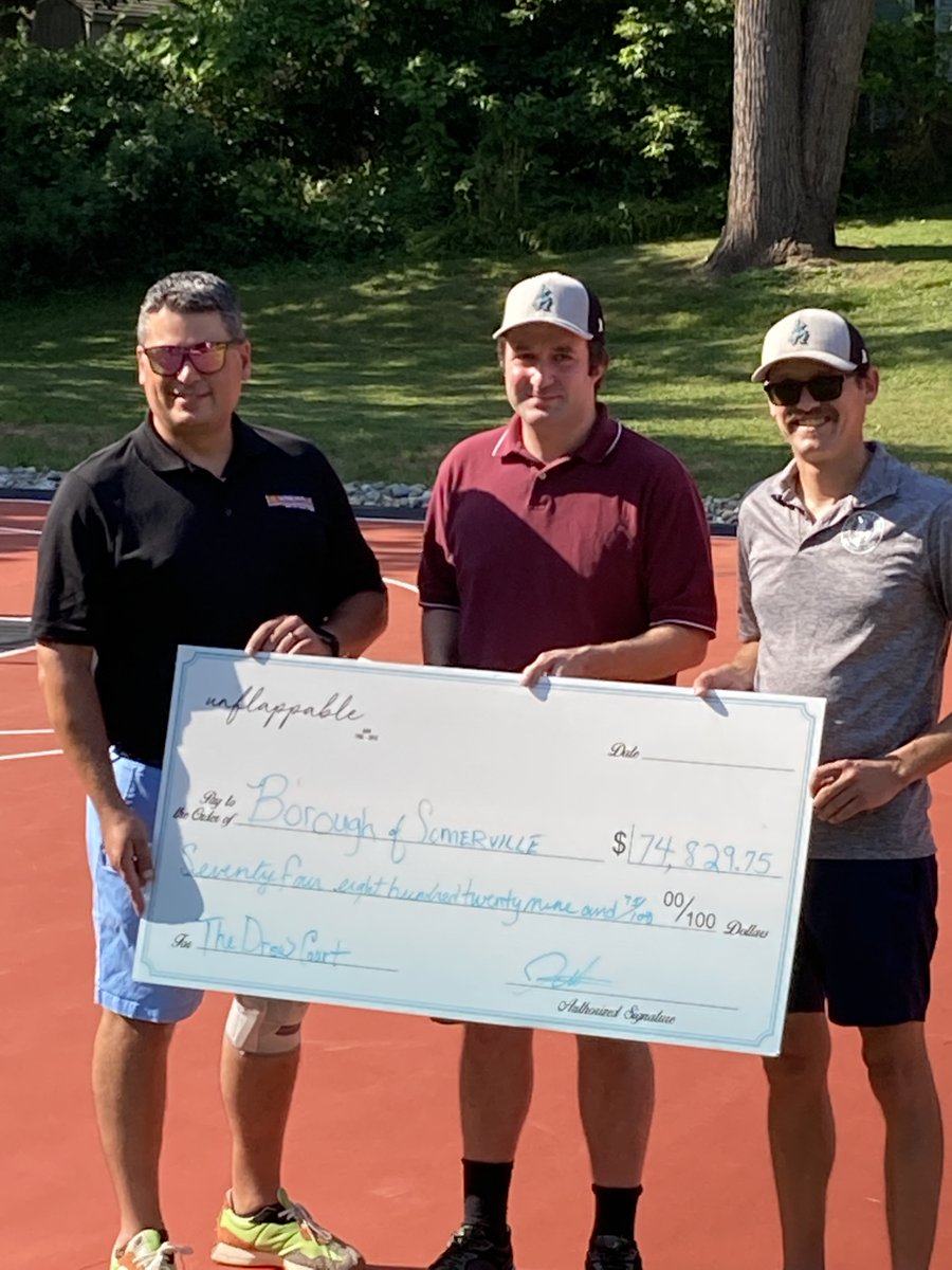 Councilman Vroom and Councilman Wied accept check from John McLachlan from the Drew McLachlan Fund "unflappable" for donation towards the newly renovated and dedicated basketball courts at Carol Pager Park
