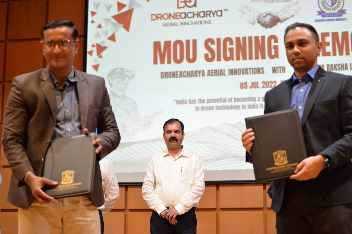 DroneAcharyaIN's tweet photo. We are glad to announce that we have signed an MOU with @RakshaUni under the able guidance of PM Shri @narendramodi and Home Minister Shri @AmitShah. We thank everyone who were present at the ceremony. @BSF_India @crpfindia @GujaratPolice @VibrantGujarat @sisdssrru https://t.co/wReiPMlnv3