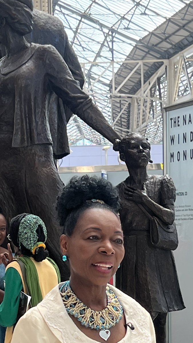 FloellaBenjamin's tweet photo. The girl in the National Windrush Monument represents me and all the children who arrived at #Waterloo Stn in the 50’s 60’s and 70’s with our ‘grips’ - suitcases. So emotional, I cried when I saw her❤️ https://t.co/ph4SKpcs37