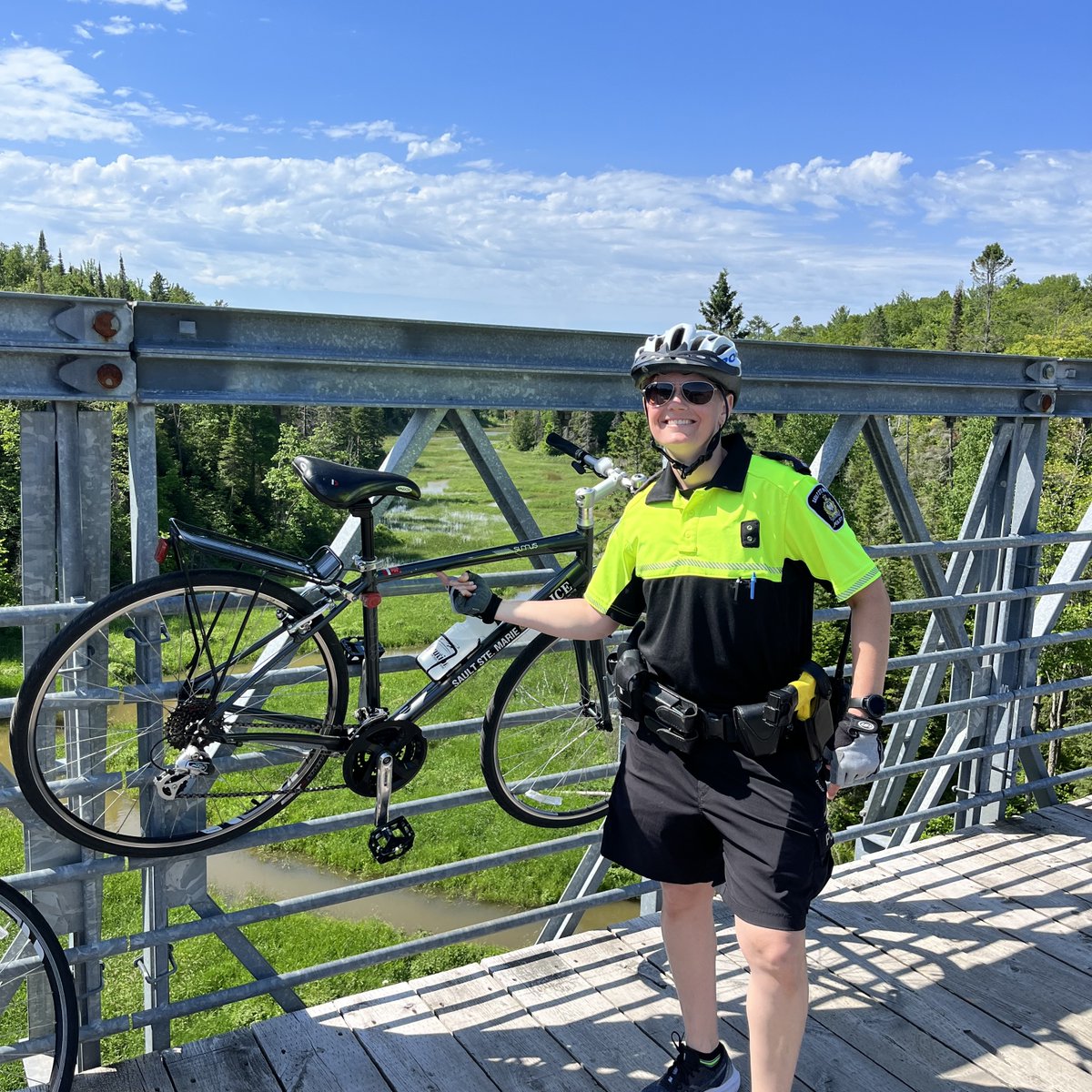 SaultPolice's tweet image. Another warm summer day in @cityssm and Cst. Houslander &amp;amp; Cst. Smith are taking the sites! #BigBlueChair #GiantTableandChairs #HubTrail