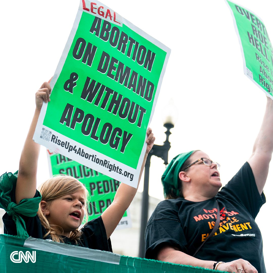 CNN's tweet photo. In pictures: Americans react after the Supreme Court ruled to overturn Roe v. Wade, holding that there is no longer a federal constitutional right to an abortion. https://t.co/qurLZ2GKwQ https://t.co/djv7ucH4DZ