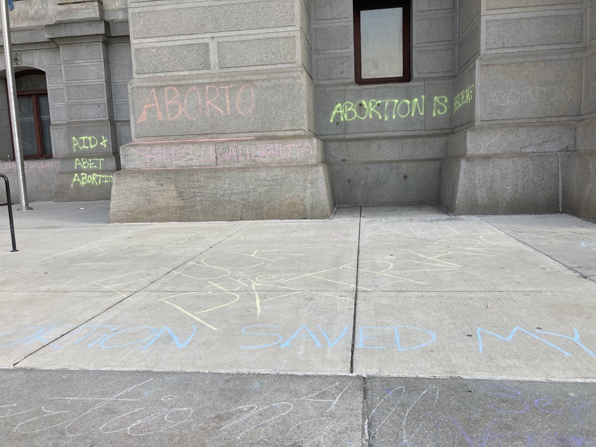 SammyCaiola's tweet photo. A chalked-up city hall, a crocheted uterus, and some pretty creative signs. Full story coming to ⁦@WHYYNews⁩ https://t.co/8xKpwBQJ0p