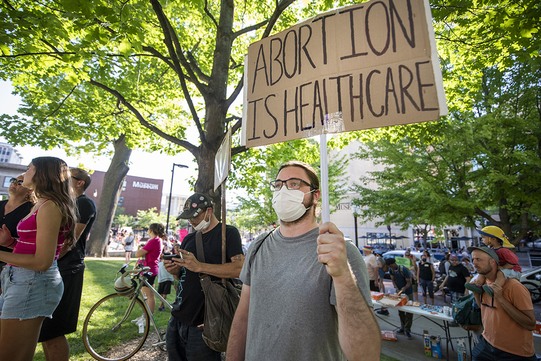 angela_major_'s tweet photo. Protesters gathered at the Wisconsin state capitol in response to the Supreme Court's decision to overturn #RoeVWade. The state's 173-year-old abortion ban makes the procedure illegal unless deemed medically necessary to save the patient's life. @WPR https://t.co/fDA3tVzqim