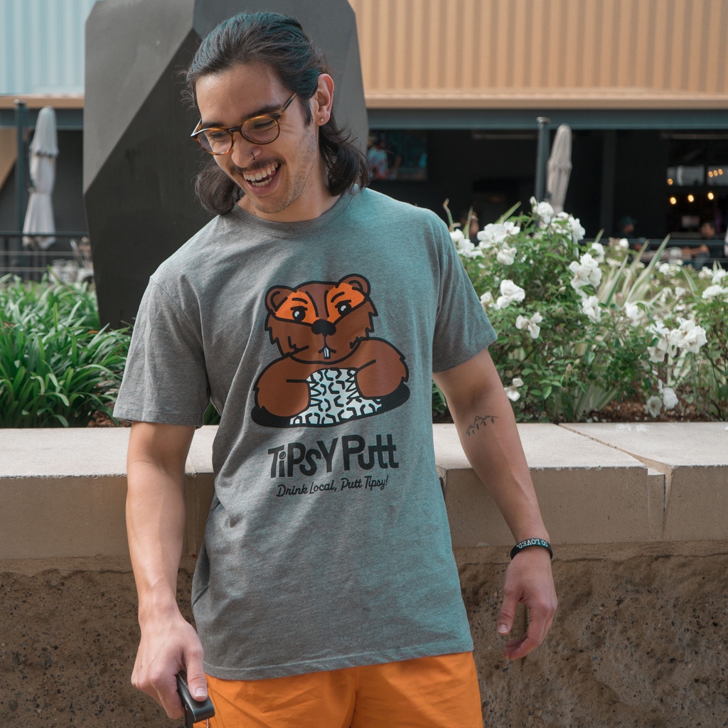 🚨 Tipsy Putt merch launch!🚨

Our Caddyshack tee will hit the shelves 7/1. Keep checking back here for new fresh gear! We will be releasing new items every week this summer. 

Modeled by: Beertender, Brenden
Photo by: <a href="/radicolt/">Colton Lane-Tokunaga</a>
Illustration by: <a href="/lilytherens/">Lily Therens</a>
