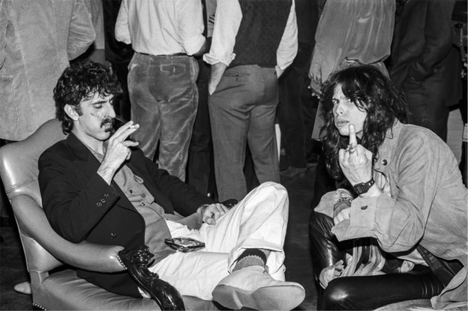 RT @crockpics: Frank Zappa lighting a cigarette for Steven Tyler, 1980 https://t.co/PvrUF0CfqN