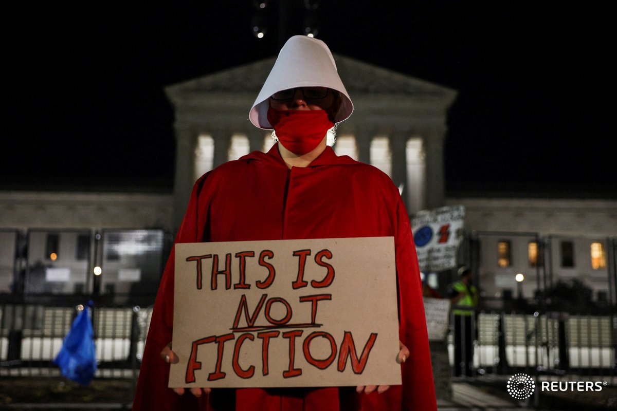 corinne_perkins (@corinne_perkins) on Twitter photo An abortion rights demonstrator dressed in a Handmaid's Tale costume, protests outside the Supreme Court, after the court ruled in the Dobbs v Women's Health Organization abortion case, overturning the landmark Roe v Wade abortion decision in Washington. Photo by <a href="/evelynpix/">Evelyn Hockstein</a> An abortion rights demonstrator dressed in a Handmaid's Tale costume, protests outside the Supreme Court, after the court ruled in the Dobbs v Women's Health Organization abortion case, overturning the landmark Roe v Wade abortion decision in Washington. Photo by <a href="/evelynpix/">Evelyn Hockstein</a>