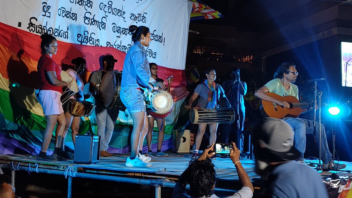 Welikumbura's tweet photo. Revolution is still pretty much alive. Today it was lit with 🌈 colours of #GotaGoGama #PrideConcert. #Aragalya is about you fighting for your rights & pride.
#lka #SriLanka #GoHomeGota #GoHomeRanil #PrideMonth #Pride2022 #pride #අරගලයටජය https://t.co/IjnIbmWXCd