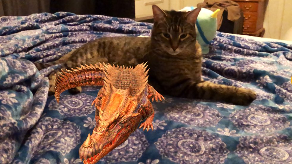Autrizzlez's tweet photo. My cat, unsure of his new friend.
#Sarcorixis
#JurassicWorldAlive #JWA4thYearAlive https://t.co/ilhf41FOfE