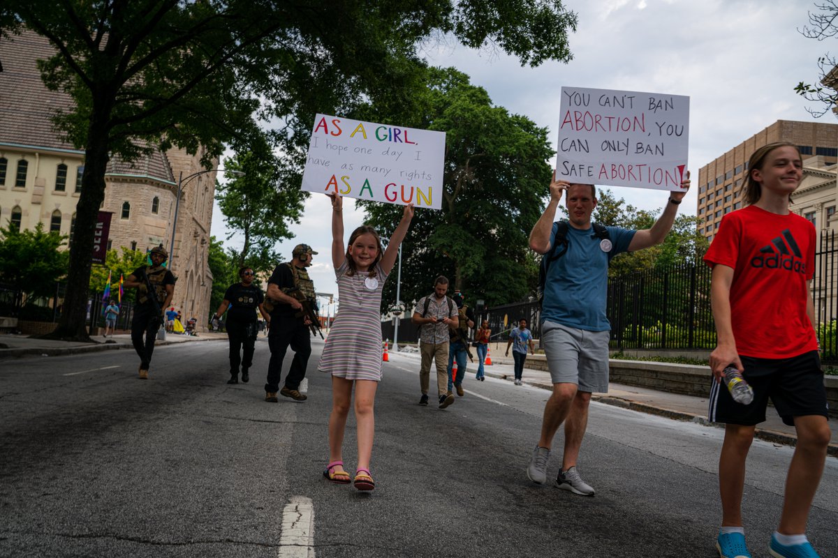 Members of the Wall of Vets take up the rear, creating a barrier between the Abortion-rights protesters and a group of Proud Boys during the second day of protests in Atlanta, Ga. For <a href="/wabenews/">WABE News</a>