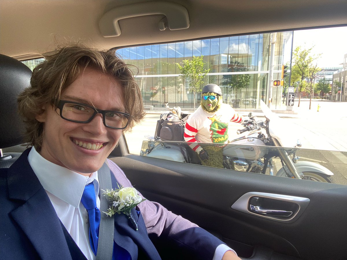 Jackie_Colville's tweet photo. @logan_colville at Abby Shima’s grad today. Rocking the suit. Hanging with the Grinch.  Normal stuff. https://t.co/mXaRN1pdUp