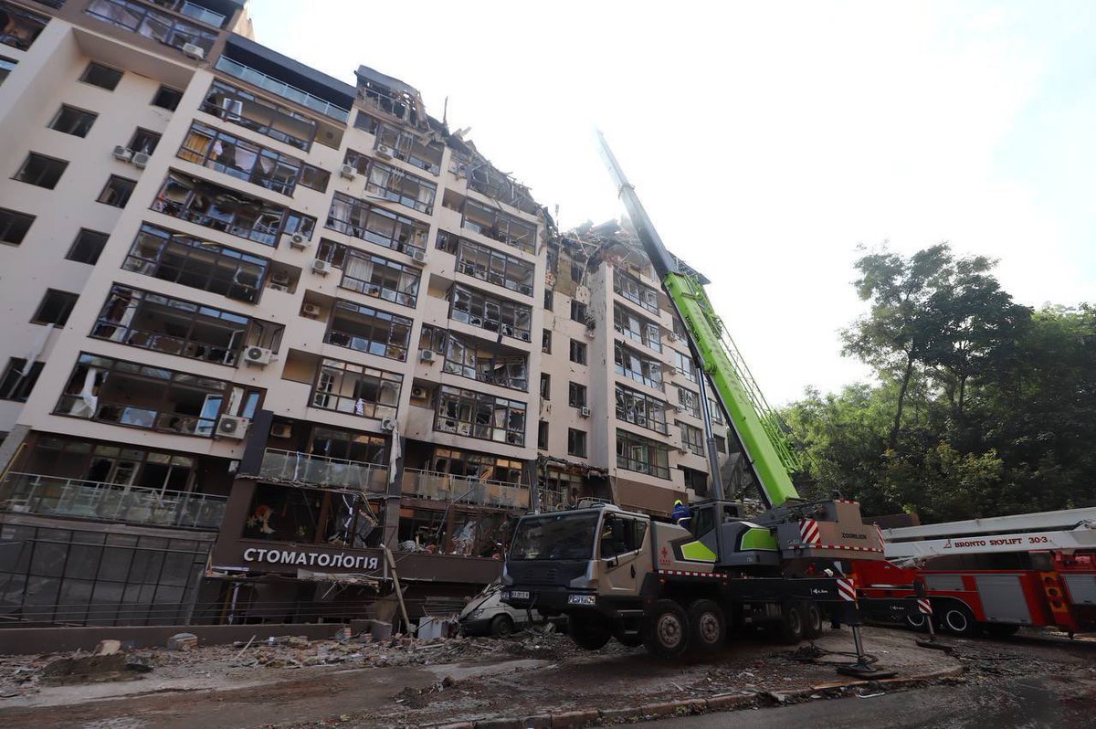 avalaina's tweet photo. This is the Sunday morning in Kyiv today. Russians hit the residential building in the centre of the city. People are under the rubble. The photos shows the work of rescuers and medics. Right now the sirens are howling again. 
#RussianWarCrimes 
Photo Oleksiy Samsonov https://t.co/LR3iMKsheX