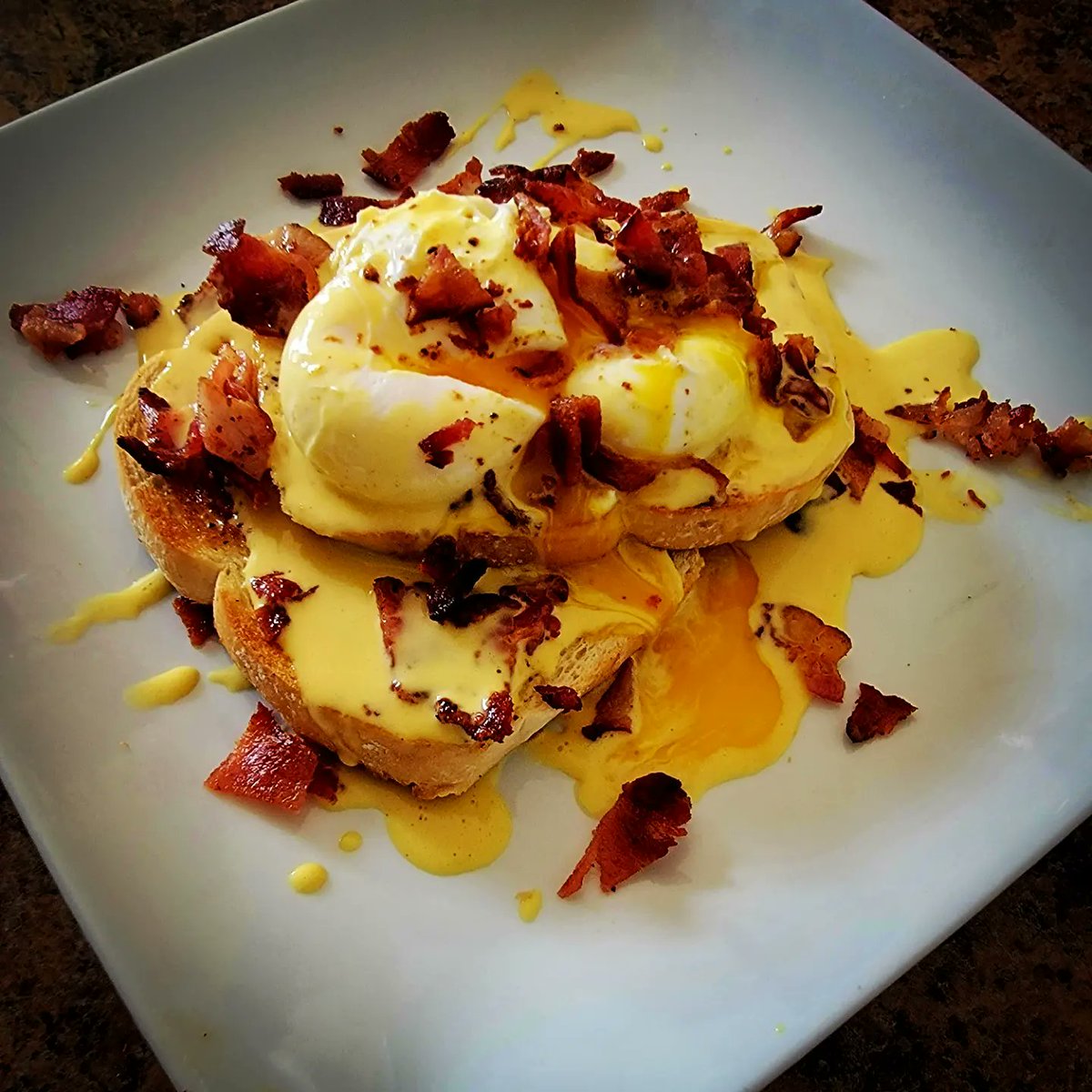 lmurr31's tweet photo. One of my favorite breakfast dishes havent made it since culinary school eggs benedict with bacon and sour dough toast https://t.co/Mjjg0hsxLf