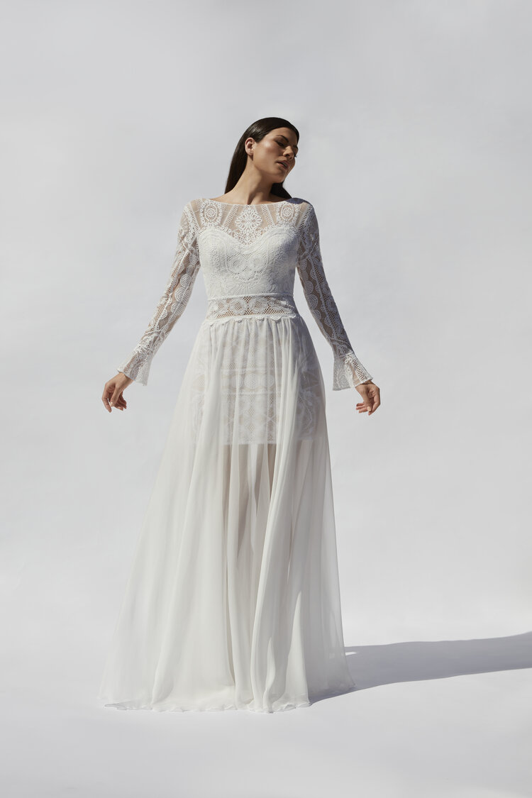 Skye by Mirka Bridal 
A perfect combination of Guipure lace and delicate chiffon skirt which flows beautifully in the wind. This dress features intricate details and textures, with a stunning cut out back and illusion lace waist panel. 
mirkabridal.com