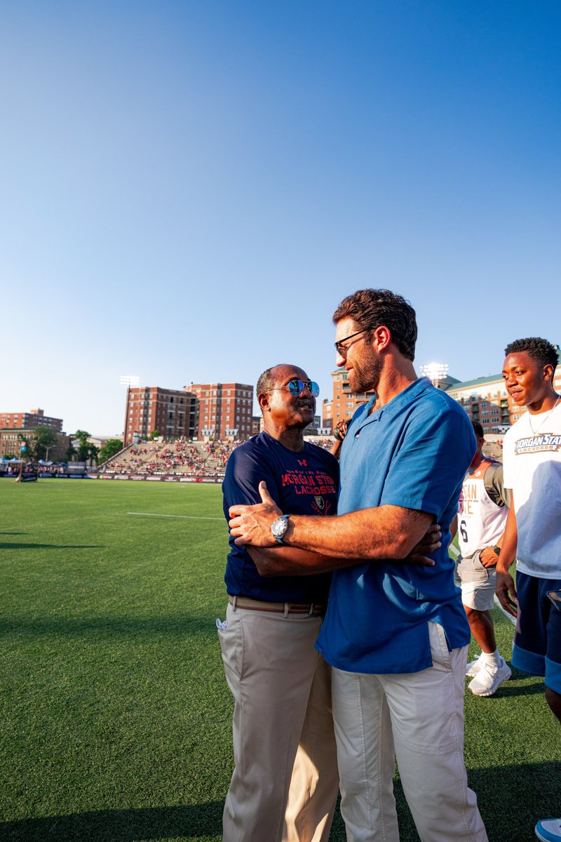 PaulRabil's tweet photo. The @PremierLacrosse was honored to recognize the 1st HBCU to play @NCAALAX back in Baltimore at Homewood. The @morganstatelax team was formed in 1970, quickly beating the #1 ranked team in the country in 1975. Here are members of the Ten Bears alongside current players today. https://t.co/J6d2KRKtPN