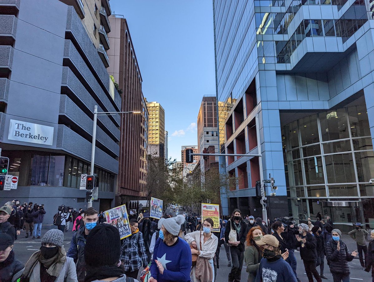 BlockadeAus's tweet photo. To hold the streets, people played drums in the middle of intersections, pushed barricades onto the road and slipped past police lines staying one step ahead; before dispersing until tomorrow.

This cooperative disruption can challenge Australia's climate destruction program. https://t.co/zCpJUg7omf