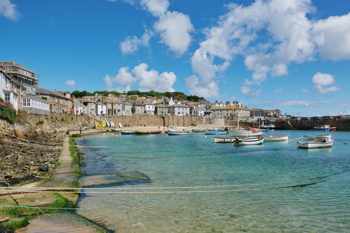 West Cornwall’s pretty fishing village of Mousehole is as enchanting as ever on a summer’s day. 

Enjoy a seafood lunch at a harbourfront bistro, wander the winding streets and dip your toes into the turquoise waters.  

Where to stay nearby: bit.ly/3OBrsRk