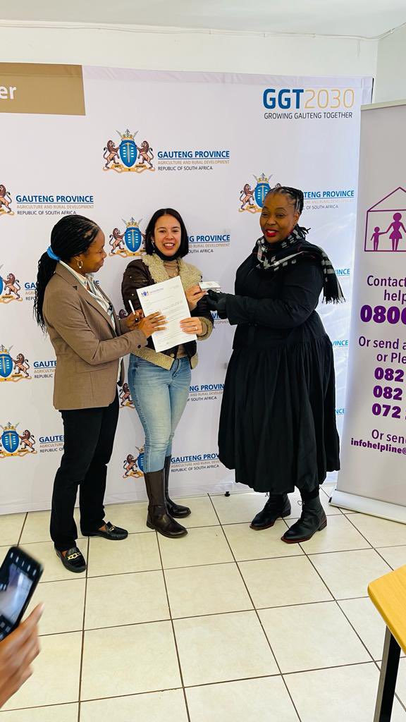 OfficialGDARD's tweet photo. Advocate S. Moleshe together with Ms Abimbola Olowa handing over the R20k Voucher to Ms. Melanie Padiachy, Assistant Coordinator at the National Shelter Movement of South Africa Office in Lenasia on behalf of the HoD for GDARD today. #GrowingGautengTogether #GDARDCares https://t.co/1PRSBzRDFr