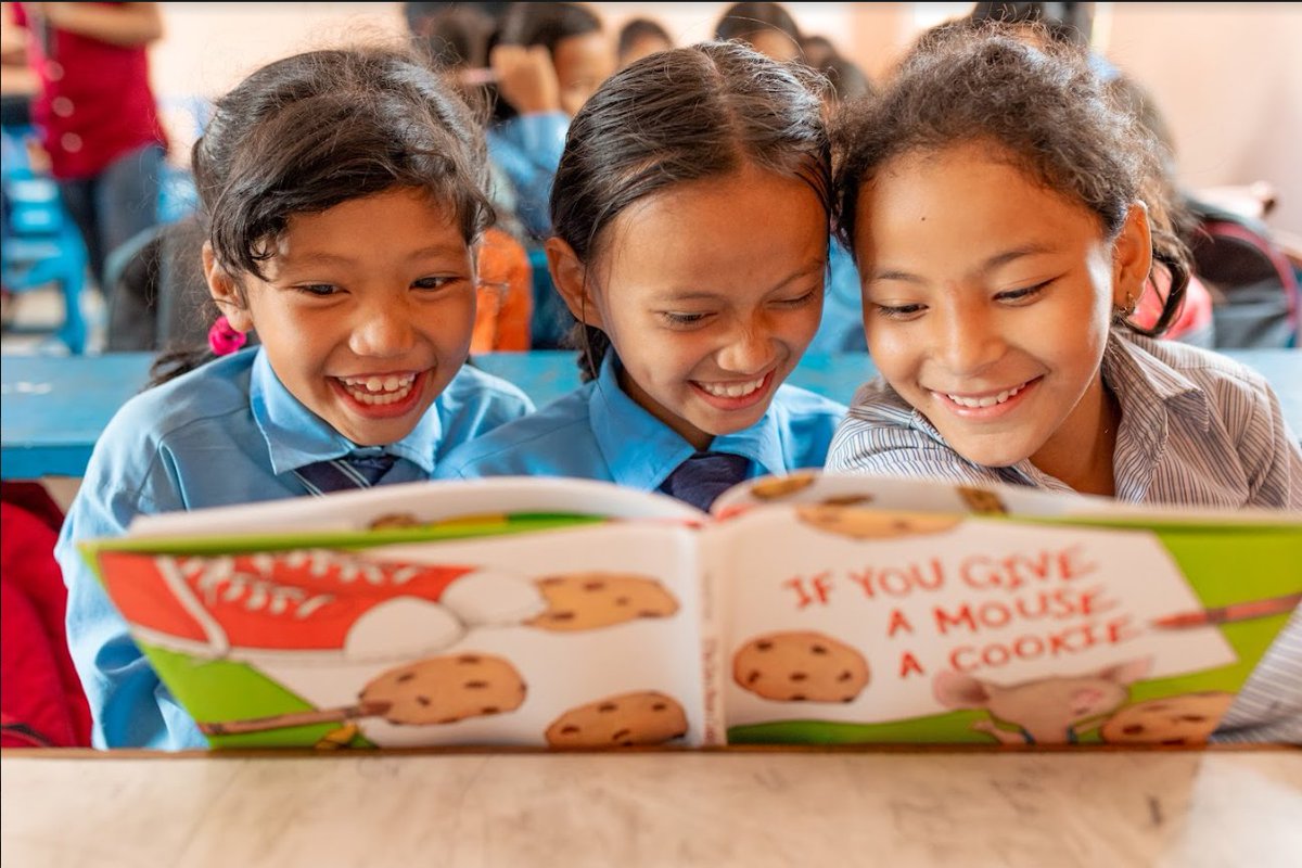 These adorable kids are reading books I signed and sent over to Nepal where VILLAGE BOOK BUILDERS was building a library!