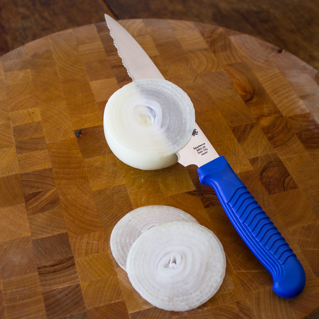 SpydercoKitchen's tweet photo. Today is National Onion Day!  Our K04 6.5" Utility Knife makes easy work of one of the world's oldest cultivated vegetables.  Its durable polypropylene handle provides exceptional comfort and control during use.  #spyderco #spydercokitchenclassics #nationalonionday https://t.co/97djo3PNkO