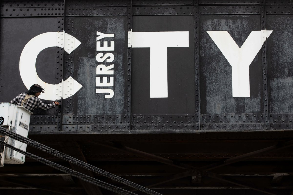 JerseyCity's tweet photo. Artist Werner Foster refreshes the Welcome To Jersey City mural on the trestle that spans across Grand Street. The original mural was completed in 2014.

#MuralMonday #JCMAP @JCArtCulture https://t.co/y0IYrd68of