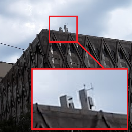 HackRacism's tweet photo. #seattleprotests Ever notice that your cell signal starts getting weird nearby city hall? Poor cell reception? Think again. What's this peeking over the top of the county admin building? A cell phone tower? That's not registered with the FCC. (1/4) https://t.co/ZdjvHtLkxN