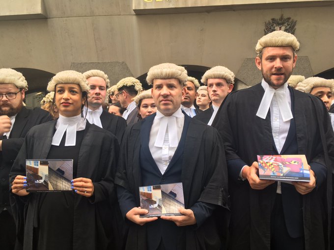 DrPaulCHIY's tweet photo. Criminal Barrister in England &amp; Wales protesting against the poor state of legal-aided Justice.Sometimes it makes you wonder what is worse: complete lack of legal aid in most developing countries (so everyone knows where they stand) or under-funded legal aid  available to  few. https://t.co/giUtNpG2yg