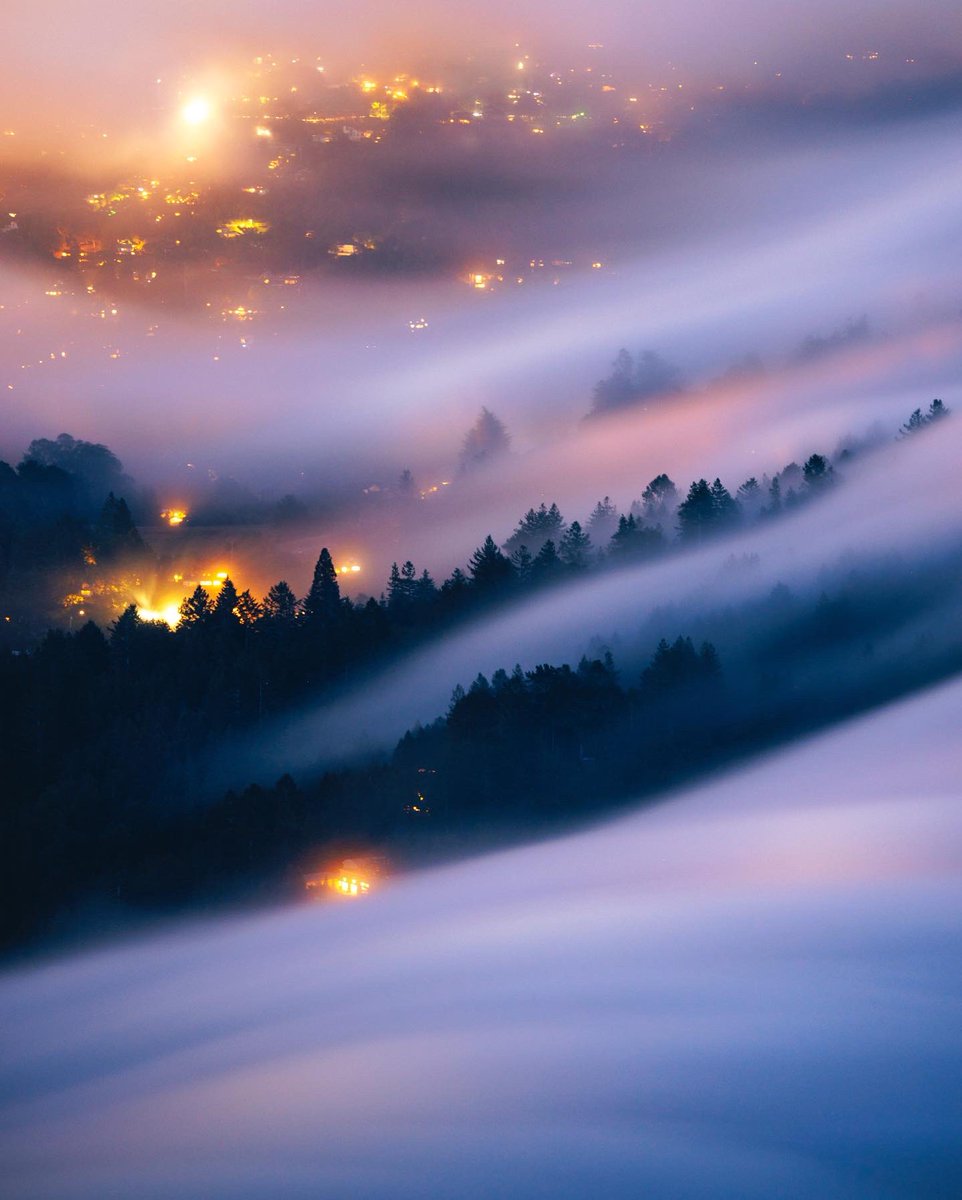 fog waves over city lights