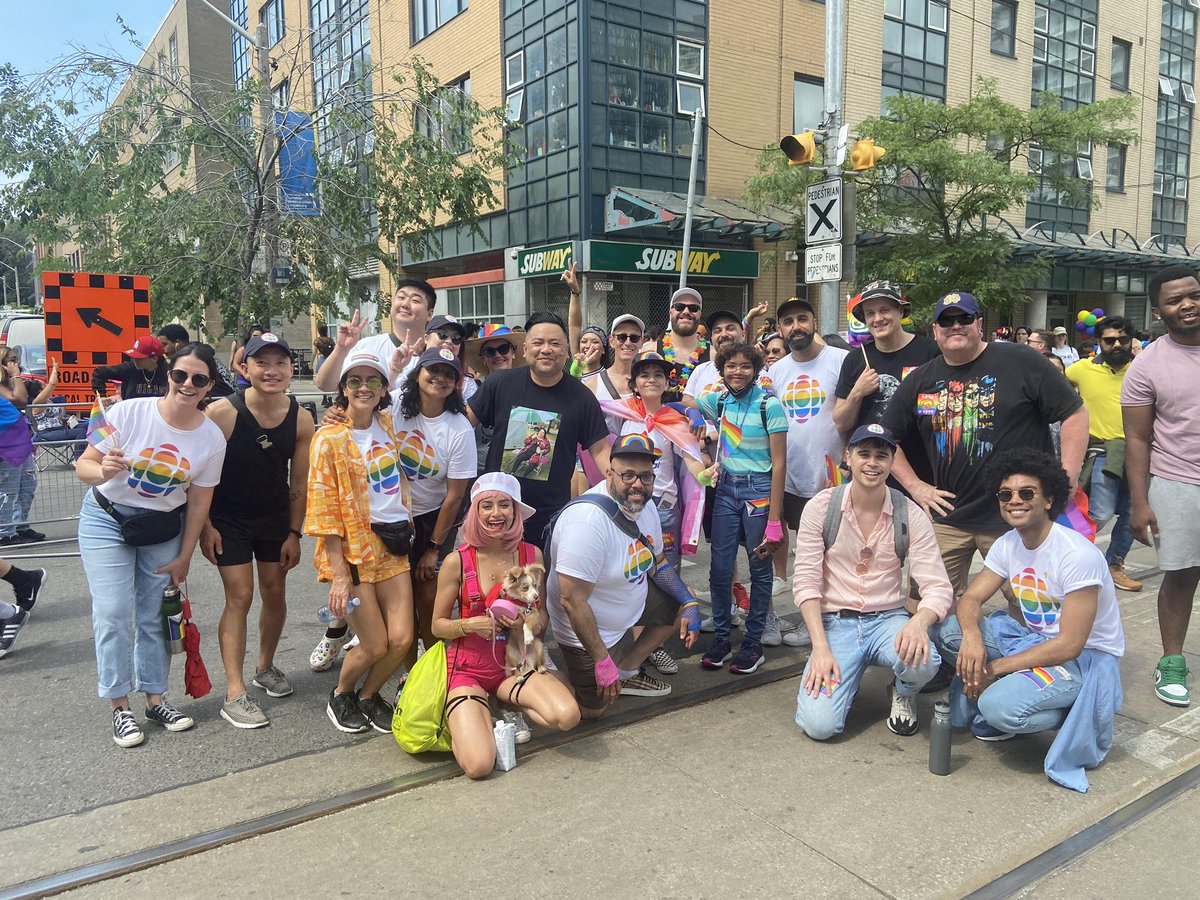 OutCBC's tweet photo. A few CBC-related shots from Toronto’s mammoth Pride Parade this past Sunday, including, Andrew Phung (Run the Burbs/Kim’s Convenience) and Alexander Nunez (Moonshine). #outCBC #PrideTO #2SLGBTQ #KimsConvenience https://t.co/oKgQ5XWAIh