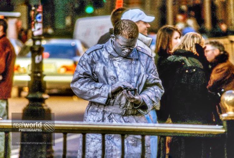 RealWorldImage's tweet photo. A street performer checks his phone between acts in central London, England. Gary Moore photo. Real World Photographs. #england #busker #london #ldn #photojournalism #world #unitedkingdom #sweden #canada #malmo #nikon #photography #garymoorephotography #realworldphotographs https://t.co/cAPbVXiJZg