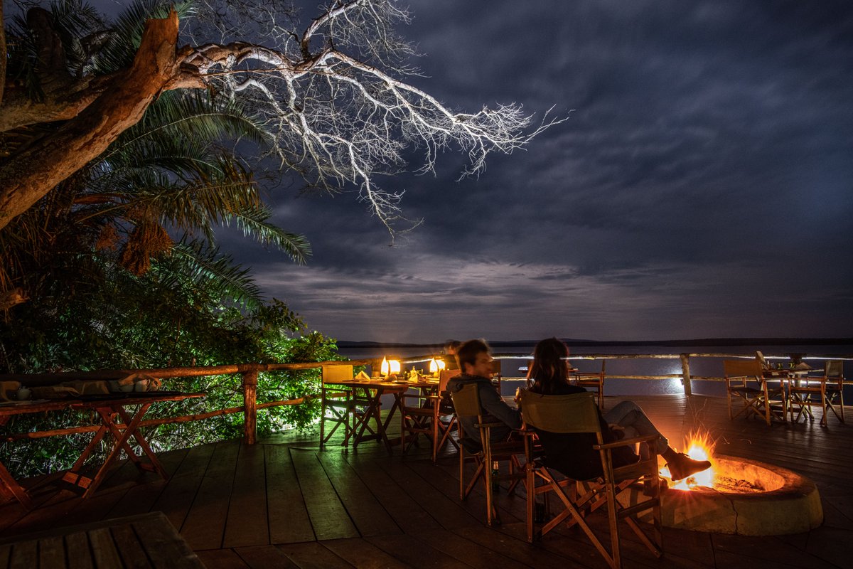 #RuziziTentedLodge is a cool and peaceful retreat sheltered by large trees and swaying palms on the edge of Lake Ihema in #Akagera. It was designed to sit gracefully with its surroundings all accessible by wooden boardwalks leading to each tent and a deck overlooking the lake.