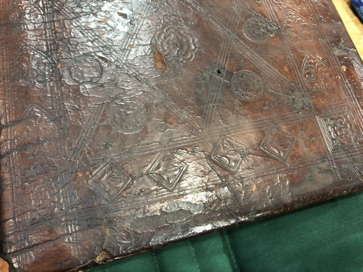 EK_Hebbard's tweet photo. This binder of this @NewberryLibrary incunable seems to have gotten distracted while stamping the leather, making these little square stampy guys very crooked on the back, where the front (image 2) has them all set neatly on point! #earlybooks #earlyprint https://t.co/Bli1RBN7vU