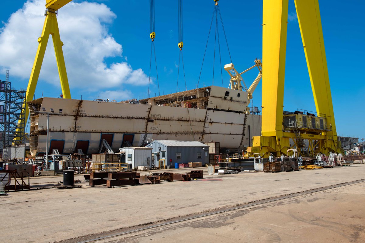 WeAreHII's tweet photo. Shipbuilders are working hard to bring Harrisburg #LPD30 to life at HII’s #IngallsShipbuilding. Take a look at this recent lift using the Goliath gantry crane. https://t.co/NcBWS91zu2