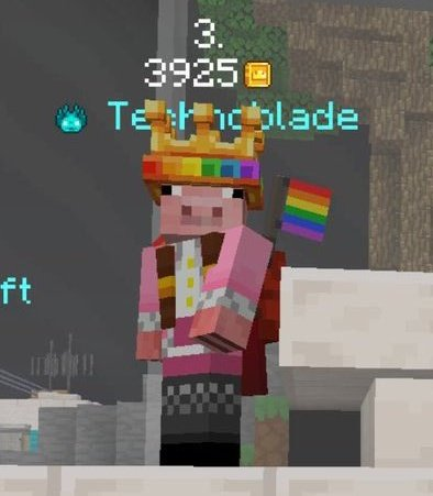 Screenshot of an NPC modeled Minecraft Youtuber and streamer Technoblade from during the first Minecraft Championships Pride event, showing his individual rankings placement. He is in third place and is wearing a rainbow crown, a backpack with rainbow flags sticking off of it, and a pink version of his skin.