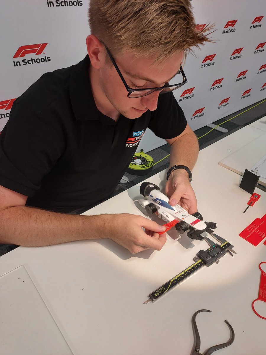 STEMRacingHQ's tweet photo. It's underway… scrutineering of our 2022 grid. It's precision design. Every 1000th gm and mm counts. #F1SWF22 #F1 https://t.co/w6BzJGY0XC