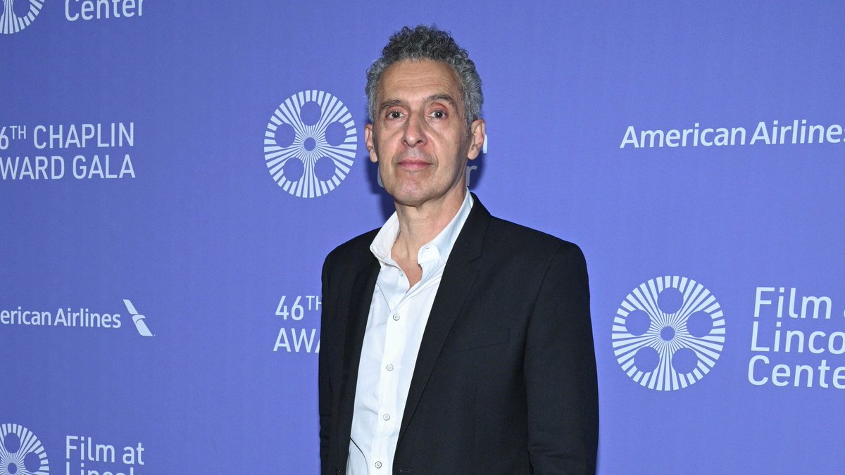 IndieWire's tweet photo. Michaela Coel, John Turturro, and Paul Dano have joined the Amazon series “Mr. and Mrs. Smith," joining Donald Glover and Maya Erskine as the lead couple hired by a mysterious spy agency, venturing into espionage, marriage, and learning to intimately navigate both. https://t.co/hfACRXcpXo
