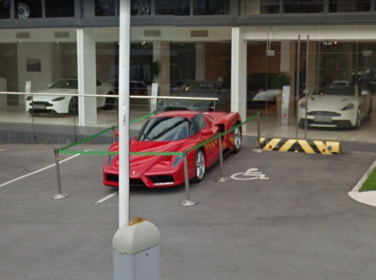 Cars_SV's tweet photo. Possibly my craziest find to date, this stunning Ferrari Enzo on display outside an Aston Martin dealership in Cannes, France - June 2015 #StreetViewCars #SV_Hypercars https://t.co/Yjklwi3rc0