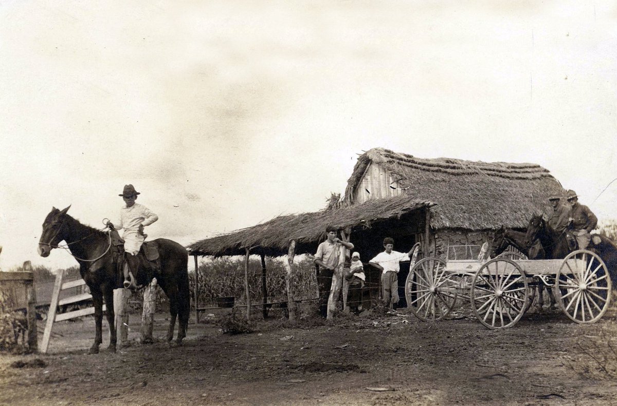 Folks outside their house (it's actually a jacal) in Pharr Texas get paid a visit by U.S. Army soldiers circa 1916. I wonder how comfortable that jacal was to live in. Looks pretty well constructed.
