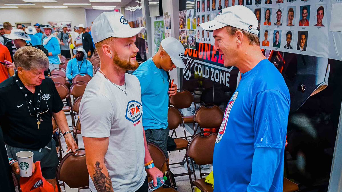 UVAFootball's tweet photo. Our 🐐 meeting some 🐐’s. @mpa_info 

We aren’t surprised @bstrong34 is keeping good company. 🤝

P.C. @ParkerWaters 

#GoHoos⚔️ https://t.co/WC9szGxEJK
