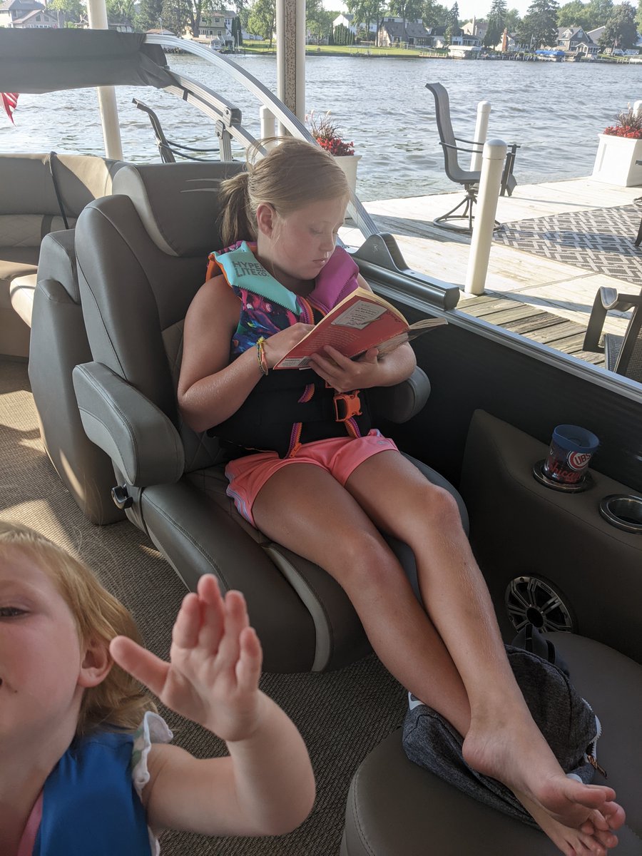 JESBloodhounds's tweet photo. Quinn Lostroscio reads while waiting for a family boat ride. #JESReads https://t.co/szsFiOiFHs