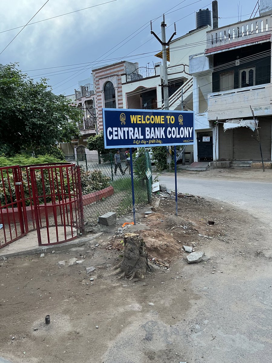bodhanapuvishnu's tweet photo. Bottom line reads, ‘Green trees are foundations for development.’ Ironically, a fully grown tree was cut to put this board!
 @eenadulivenews @KTRTRS https://t.co/6RkJjiRHKR