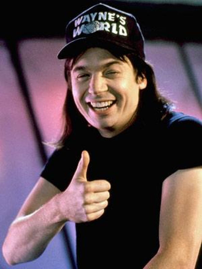 Mike Myers as Wayne Campbell, host of Wayne's World. 