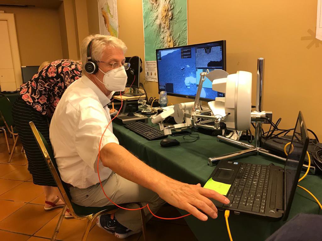 ESA_Tech's tweet photo. The two halves of this afternoon’s #Analog1 test: @ESA astronaut Thomas Reiter 23 km away in #Catania 🇮🇹 &amp; the Interact rover he will control, 2600 m up #MountEtna #ARCHES22 #RobotsOnEtna https://t.co/1WRbPLFbw8