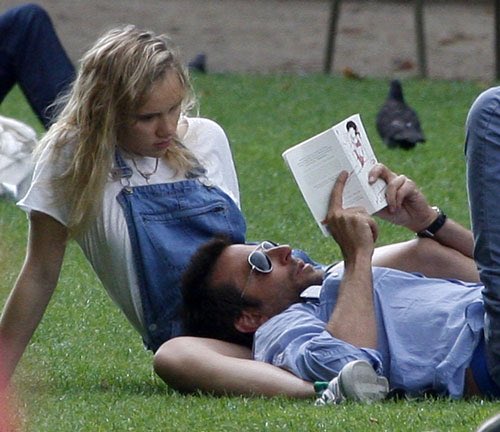 rosielanners's tweet photo. I think about these paparazzi pics of bradley cooper (38) reading lolita to a bored suki waterhouse (21) in a parisian park like, at least once a week https://t.co/Xb0tHBFwqq