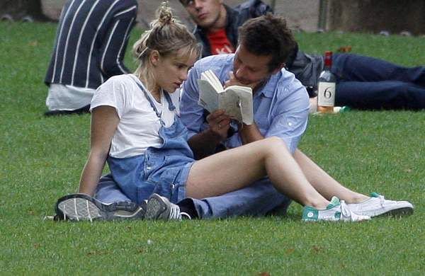 rosielanners's tweet photo. I think about these paparazzi pics of bradley cooper (38) reading lolita to a bored suki waterhouse (21) in a parisian park like, at least once a week https://t.co/Xb0tHBFwqq