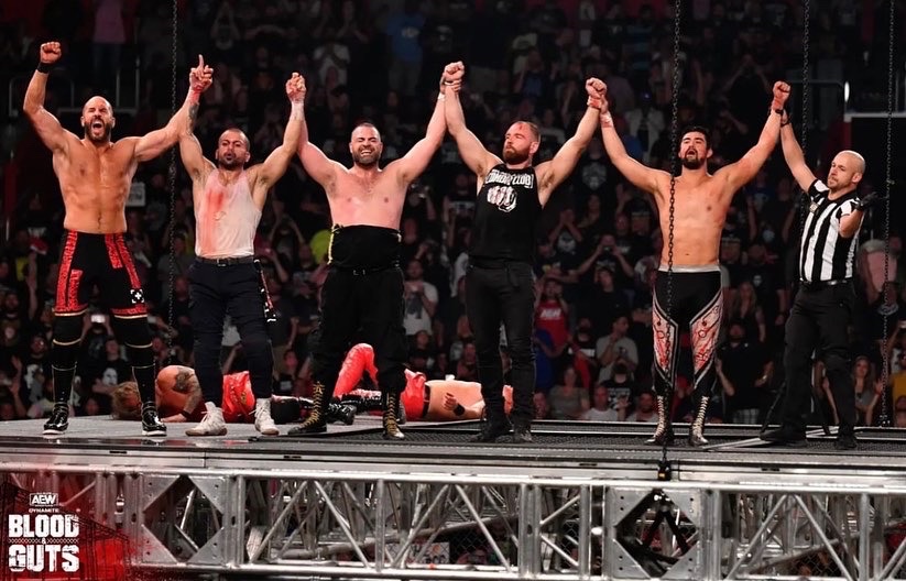 mookieghana's tweet photo. Somehow, these maniacs convinced @dabryceisright to climb the cage and raise their hands. All part of the being a great @AEW referee. #BloodAndGuts https://t.co/0vFl9K2uFo