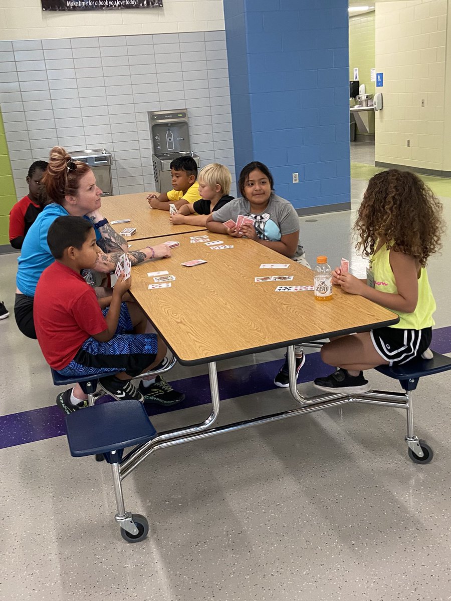BreannaBea's tweet photo. Students play card games together for POWER Camp field day! #LastDayFun #SummerAtGIPS @GIPublicSchools https://t.co/bFOcVKr07G