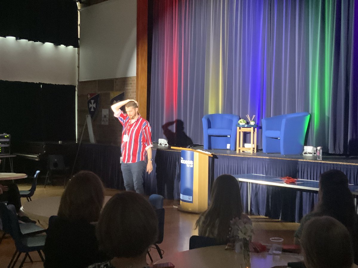 We now have @LewisBuxton93 performing his amazing poetry to our winners and their families. What a treat for all of them, to see a poet live. We know that some of them could have this in their future! #cdownlitfest