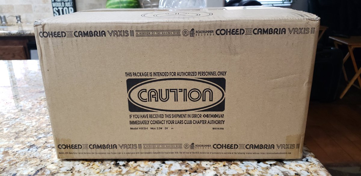 Pixel_Grip94's tweet photo. I swear to God, @Coheed are trying to make hoarders out of us. I was planning on keeping the box anyway guys. You really didn't have to go so hard...that being said, this box is fucking beautiful. I'm even trying to take the tape off without damaging it. #Vaxis2 #AWOTWM https://t.co/qFYQwcwsoQ