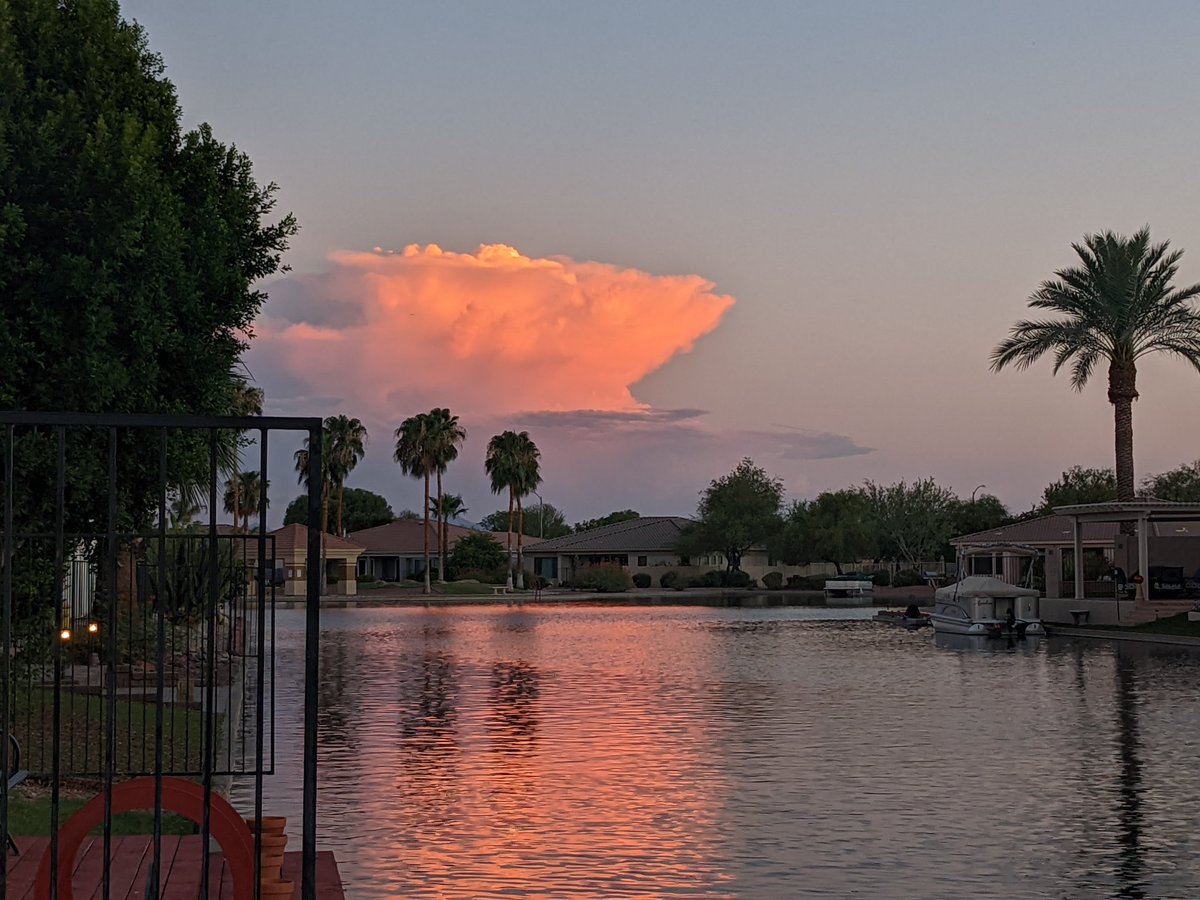 ‼️ For the first time in MONTHS (almost all of 2022), my backyard isn't a dirt pit!!! Turf was just put in today, and I'm able to enjoy a gorgeous evening... To top it off, I've got a view of a distant thunderstorm glowing in the sunset and reflecting off the water 😍 #azwx